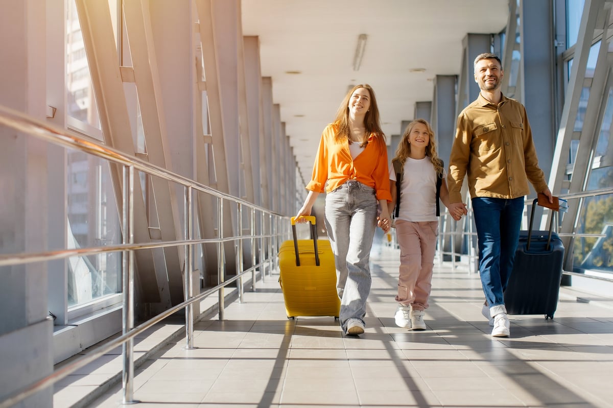 Family walking together at airport
